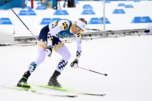Sweden's Frida Karlsson reacts after crossing the finish line during the women's cross-country skiing 10km interval start free event of the Milano Cortina 2026 Winter Olympic Games at Tesero Cross-Country Skiing Stadium in Lago di Tesero (Val di Fiemme), on February 12, 2026. (Photo by Tobias SCHWARZ / AFP)
