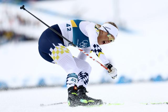 Sweden's Frida Karlsson reacts after crossing the finish line during the women's cross-country skiing 10km interval start free event of the Milano Cortina 2026 Winter Olympic Games at Tesero Cross-Country Skiing Stadium in Lago di Tesero (Val di Fiemme), on February 12, 2026. (Photo by Anne-Christine POUJOULAT / AFP)