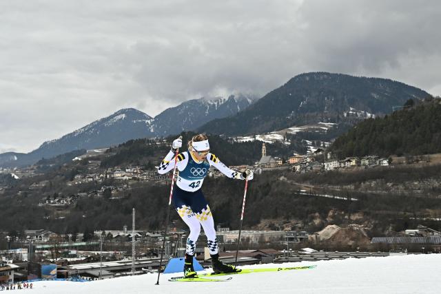 Sweden's Frida Karlsson competes during the women's cross-country skiing 10km interval start free event of the Milano Cortina 2026 Winter Olympic Games at Tesero Cross-Country Skiing Stadium in Lago di Tesero (Val di Fiemme), on February 12, 2026. (Photo by Javier SORIANO / AFP)