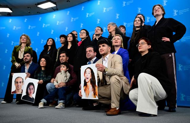 Berlinale director Tricia Tuttle (L) poses with the team of opening film "No Good Men" during a photo call for the film presented as Berlinale Special Gala at the 76th Berlinale, Europe's first major film festival of the year, in Berlin on February 12, 2026. (Photo by John MACDOUGALL / AFP)