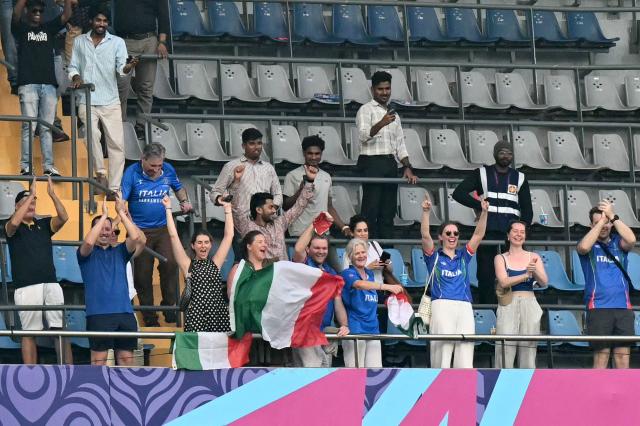Italy's fans cheer during the 2026 ICC Men's T20 Cricket World Cup group stage match between Nepal and Italy at the Wankhede Stadium in Mumbai on February 12, 2026. (Photo by Punit PARANJPE / AFP)