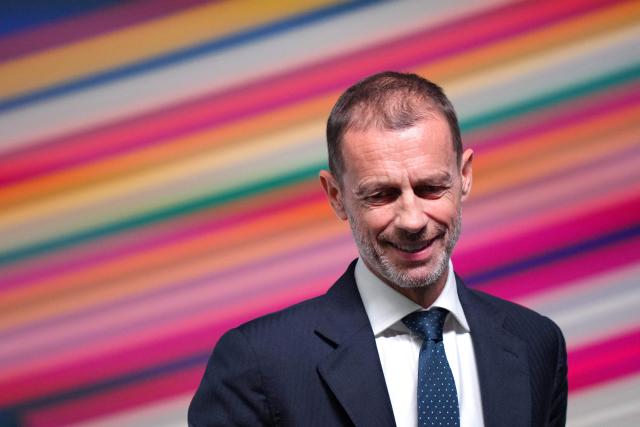 UEFA president Aleksander Ceferin looks on after interacting with children ahead of addressing a press conference at the 50th UEFA Ordinary Congress in Brussels on February 12, 2026. (Photo by Pau BARRENA / AFP)