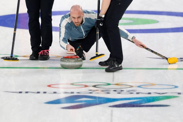 Norway's Magnus Ramsfjell delivers the stone during the curling men's round robin between Norway and Germany during the Milano Cortina 2026 Winter Olympic Games at the Cortina Curling Olympic Stadium in Cortina d’Ampezzo on February 12, 2026. (Photo by Odd ANDERSEN / AFP)