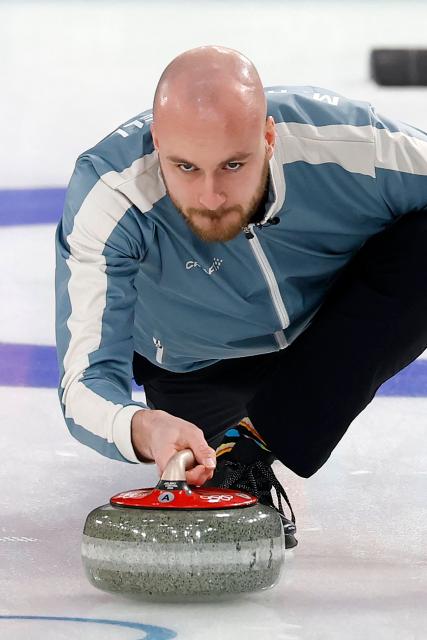 Norway's Magnus Ramsfjell delivers the stone during the curling men's round robin between Norway and Germany during the Milano Cortina 2026 Winter Olympic Games at the Cortina Curling Olympic Stadium in Cortina d’Ampezzo on February 12, 2026. (Photo by Odd ANDERSEN / AFP)