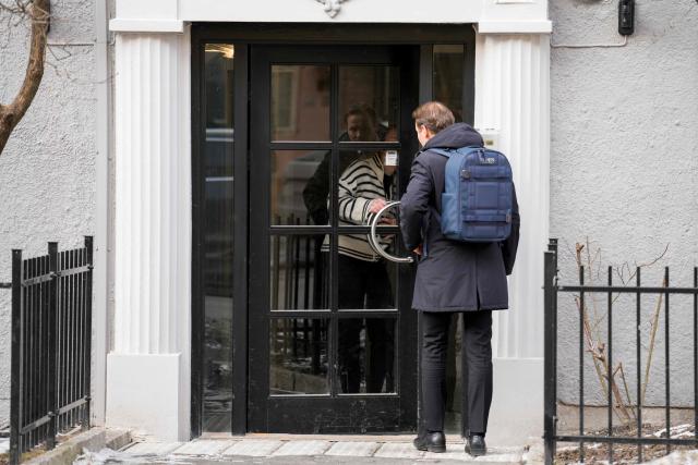 A man stands outside a residential building with the apartment of Former Prime Minister of Norway Thorbjorn Jagland in Oslo on February 12, 2026. Norwegian police said they had searched properties belonging to former prime minister Thorbjorn Jagland following the launch of a corruption probe over his dealings with US sex offender Jeffrey Epstein. Jagland is being investigated after documents released by the US Justice Department in January suggested that he and/or his family stayed or vacationed with Epstein between 2011 and 2018. (Photo by Stian Lysberg Solum / NTB / AFP) / Norway OUT