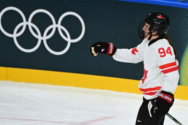 Canada's forward #94 Jennifer Gardiner celebrates after scoring during the women's preliminary round Group A Ice Hockey match between Finland and Canada at the Milano Rho Ice Hockey Arena during the Milano Cortina 2026 Winter Olympic Games in Milan, on February 12, 2026. (Photo by Piero CRUCIATTI / AFP)