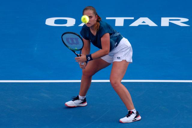 Latvia's Jelena Ostapenko returns a shot during her women’s singles quarter-final match against Italy's Elisabetta Cocciaretto at the Qatar Open tennis tournament in Doha on February 12, 2026. (Photo by Karim JAAFAR / AFP)