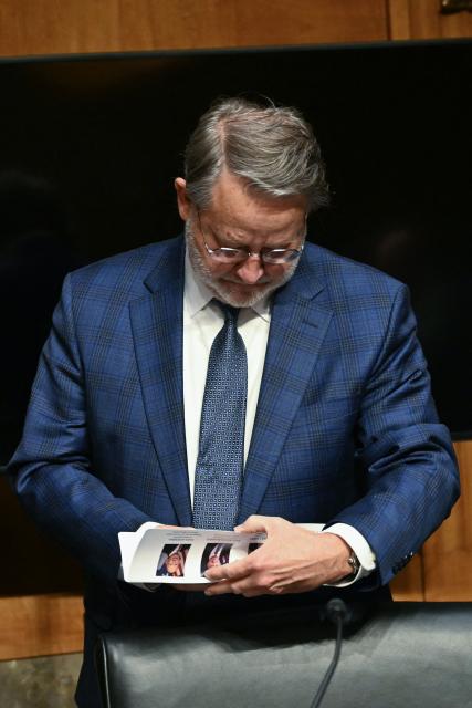 Committee ranking member Senator Gary Peters , Democrat from Michigan arrives during a Senate Homeland Security and Governmental Affairs Committee in an oversight hearing amid scrutiny over immigration enforcement and recent developments in Minnesota at the Dirksen Senate Office Building in Washington, DC on February 12, 2026. (Photo by Brendan SMIALOWSKI / AFP)