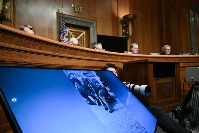 Images from Minnesota are displayed during a Senate Homeland Security and Governmental Affairs Committee in an oversight hearing amid scrutiny over immigration enforcement and recent developments in Minnesota at the Dirksen Senate Office Building in Washington, DC on February 12, 2026. (Photo by Brendan SMIALOWSKI / AFP)
