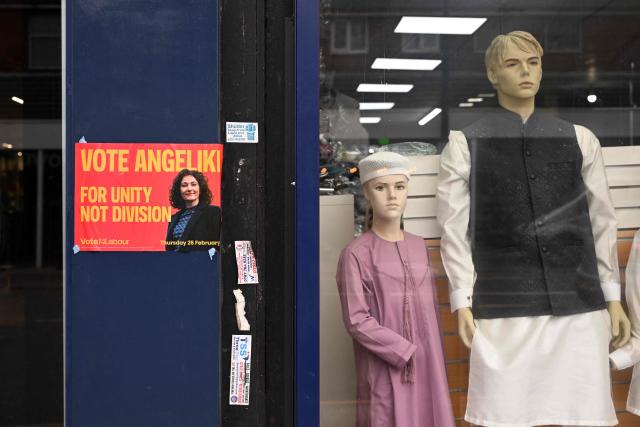 A poster supporting Britain's Labour Party candidate Angeliki Stogia, is pictured outside a shop in in Longsight, Greater Manchester on February 12, 2026, as parties begin to canvas voters ahead of the crucial Gorton and Denton by-election. The Gorton and Denton by-election on February 26 for one of Labour's parliamentary seats will be fiercely contested. (Photo by Oli SCARFF / AFP)
