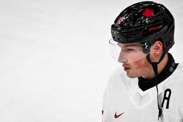 Canada's #08 Cale Makar reacts as he warms up during the men's preliminary round Group A Ice Hockey match between Czech Republic and Canada at the Milano Santagiulia Ice Hockey Arena during the Milano Cortina 2026 Winter Olympic Games in Milan, on February 12, 2026. (Photo by Alexander NEMENOV / AFP)