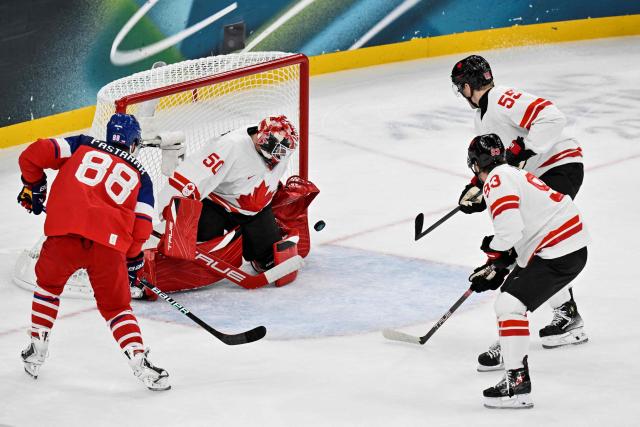 Canada's #50 Jordan Binnington makes a save during the men's preliminary round Group A Ice Hockey match between Czech Republic and Canada at the Milano Santagiulia Ice Hockey Arena during the Milano Cortina 2026 Winter Olympic Games in Milan, on February 12, 2026. (Photo by Alexander NEMENOV / AFP)