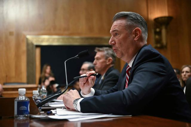 (L/R) Director of US Citizenship and Immigration Services (USCIS) Joseph Edlow, US Customs and Border Protection (CBP) Commissioner Rodney Scott, and Acting Director of US Immigration and Customs Enforcement (ICE) Todd Lyons testify before a Senate Homeland Security and Governmental Affairs Committee in an oversight hearing amid scrutiny over immigration enforcement and recent developments in Minnesota at the Dirksen Senate Office Building in Washington, DC on February 12, 2026. (Photo by Brendan SMIALOWSKI / AFP)