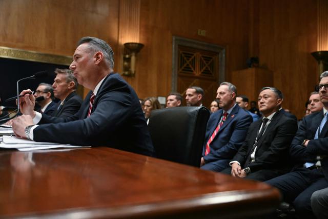 (L/R) Director of US Citizenship and Immigration Services (USCIS) Joseph Edlow, US Customs and Border Protection (CBP) Commissioner Rodney Scott, and Acting Director of US Immigration and Customs Enforcement (ICE) Todd Lyons testify before a Senate Homeland Security and Governmental Affairs Committee in an oversight hearing amid scrutiny over immigration enforcement and recent developments in Minnesota at the Dirksen Senate Office Building in Washington, DC on February 12, 2026. (Photo by Brendan SMIALOWSKI / AFP)