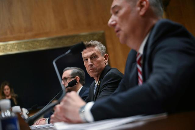 (L/R) Director of US Citizenship and Immigration Services (USCIS) Joseph Edlow, US Customs and Border Protection (CBP) Commissioner Rodney Scott, and Acting Director of US Immigration and Customs Enforcement (ICE) Todd Lyons testify before a Senate Homeland Security and Governmental Affairs Committee in an oversight hearing amid scrutiny over immigration enforcement and recent developments in Minnesota at the Dirksen Senate Office Building in Washington, DC on February 12, 2026. (Photo by Brendan SMIALOWSKI / AFP)