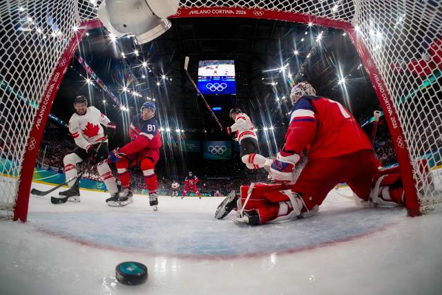 Canada's #61 Mark Stone scores his team second goal during the men's preliminary round Group A Ice Hockey match between Czech Republic and Canada at the Milano Santagiulia Ice Hockey Arena during the Milano Cortina 2026 Winter Olympic Games in Milan, on February 12, 2026. (Photo by POOL / AFP)