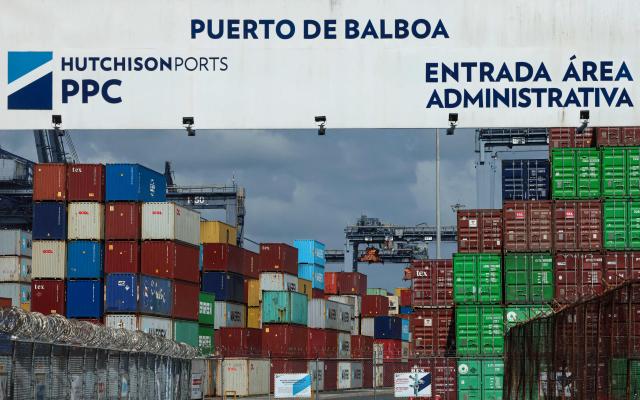 Shipping containers are stored at the port of Balboa in Panama City on February 12, 2026. Hong Kong-based conglomerate CK Hutchison warned on February 12 of possible legal action against Danish firm Maersk and others over the annulment of its contract to operate two ports on the Panama Canal. (Photo by MARTIN BERNETTI / AFP)