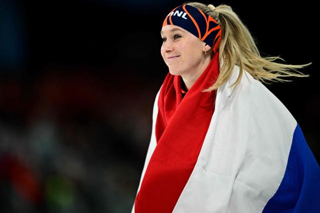 Netherlands' Merel Conijn celebrates after winning silver in the speed skating women's 5000m during the Milano Cortina 2026 Winter Olympic Games at Milano Speed Skating Stadium in Milan on February 12, 2026. (Photo by JULIEN DE ROSA / AFP)