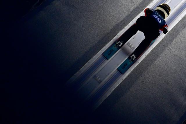 Norway's Heidi Dyhre Traaserud slides down the inrun track during the women's ski jumping large hill training of the Milano Cortina 2026 Winter Olympic Games at Predazzo Ski Jumping Stadium in Predazzo (Val di Fiemme), on February 12, 2026. (Photo by Tobias SCHWARZ / AFP)