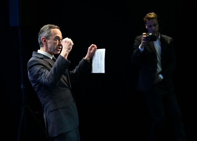 TOPSHOT - France's former Interior Minister Bruno Retailleau reacts after addressing an audience in Paris on February 12, 2026, as he announced his candidacy for the country's 2027 presidential elections. Bruno Retailleau announced that he will run in the 2027 presidential election, in a message shared with his party members seen by AFP. (Photo by Bertrand GUAY / AFP)