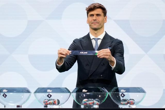 Former Spanish international Fernando Llorente shows up the paper slip for Iceland during the 2026/27 UEFA Nations League league phase group C draw ceremony as part of the European football governing body's 50th annual Ordinary Congress in Brussels on February 12, 2026. (Photo by Pau BARRENA / AFP)