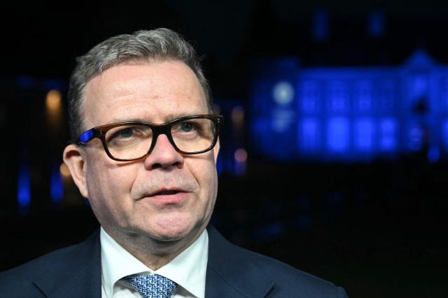 Finland's Prime Minister Petteri Orpo addresses the media as he leaves after attending the Informal EU Leaders' Retreat at the Alden Biesen Castle, in Rijkhoven on February 12, 2026. (Photo by NICOLAS TUCAT / AFP)