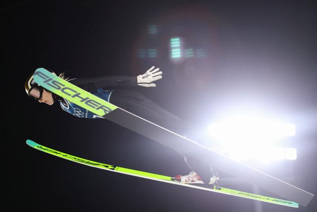 France's Emma Chervet jumps during the women's ski jumping large hill training of the Milano Cortina 2026 Winter Olympic Games at Predazzo Ski Jumping Stadium in Predazzo (Val di Fiemme), on February 12, 2026. (Photo by Anne-Christine POUJOULAT / AFP)