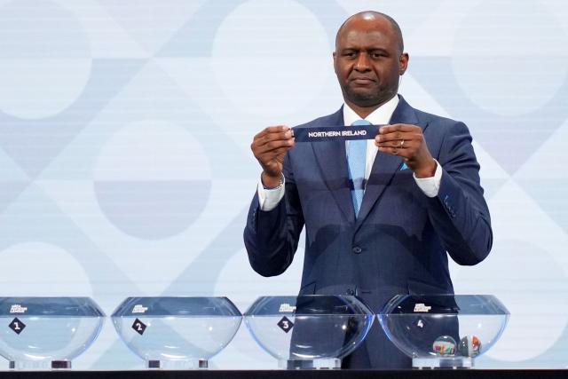 Former French international Patrick Vieira shows up the paper slip for Northern Ireland during the 2026/27 UEFA Nations League league phase group B draw ceremony as part of the European football governing body's 50th annual Ordinary Congress in Brussels on February 12, 2026. (Photo by Pau BARRENA / AFP)
