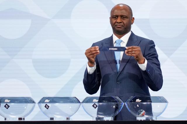 Former French international Patrick Vieira shows up the paper slip for Sweden during the 2026/27 UEFA Nations League league phase group B draw ceremony as part of the European football governing body's 50th annual Ordinary Congress in Brussels on February 12, 2026. (Photo by Pau BARRENA / AFP)