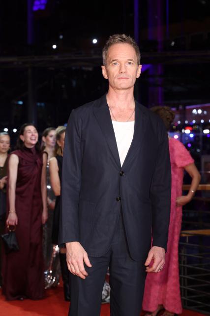 US actor Neil Patrick Harris arrives on the red carpet for the premiere of the film "No Good Men" presented in the Berlinale Special Gala section and opening the 76th Berlinale, Europe's first major film festival of the year, in Berlin on February 12, 2026. (Photo by Ronny HARTMANN / AFP)