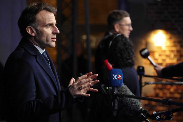 France's President Emmanuel Macron addresses the media as he leaves after attending the Informal EU Leaders' Retreat at the Alden Biesen Castle, in Rijkhoven on February 12, 2026. (Photo by Ludovic MARIN / AFP)