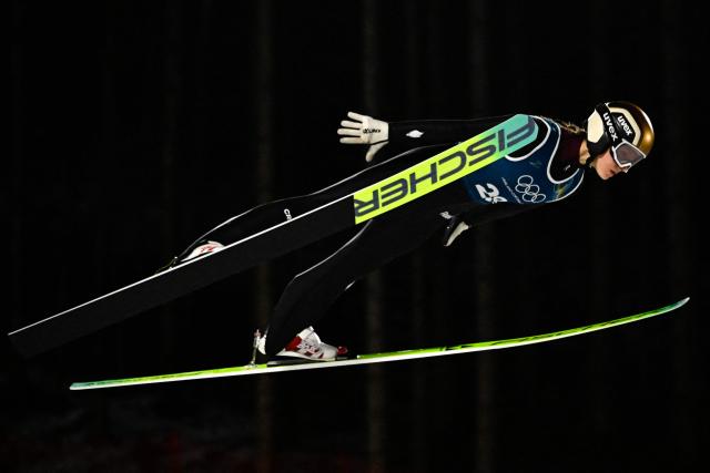 France's Josephine Pagnier jumps during the women's ski jumping large hill training of the Milano Cortina 2026 Winter Olympic Games at Predazzo Ski Jumping Stadium in Predazzo (Val di Fiemme), on February 12, 2026. (Photo by Tobias SCHWARZ / AFP)