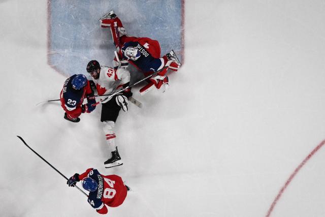 Canada's #43 Thomas Wilson (C) reacts after being tackled during the men's preliminary round Group A Ice Hockey match between Czech Republic and Canada at the Milano Santagiulia Ice Hockey Arena during the Milano Cortina 2026 Winter Olympic Games in Milan, on February 12, 2026. (Photo by Alexander NEMENOV / AFP)