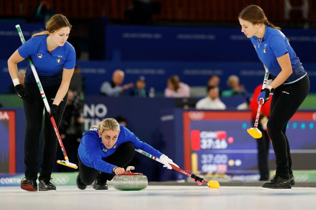 Italy's Elena Mathis (C) delivers the stone during during the curling women's round robin between Italy and South Korea during the Milano Cortina 2026 Winter Olympic Games at the Cortina Curling Olympic Stadium in Cortina d’Ampezzo on February 12, 2026. (Photo by Odd ANDERSEN / AFP)