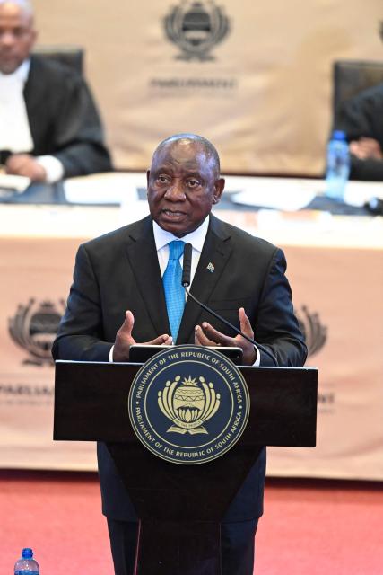 South African President Cyril Ramaphosa gestures as he delivers the State of the Nation (SONA) address in Cape Town on February 12, 2026. (Photo by Rodger Bosch / POOL / AFP)