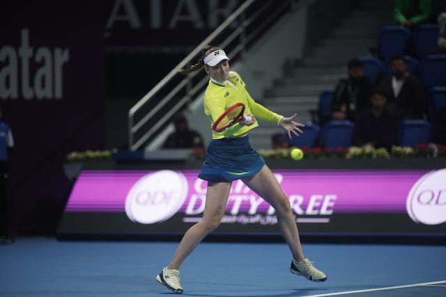 Kazakhstan's Elena Rybakina hits a return against Canada's Victoria Mboko during their women’s singles quarter-final match at the Qatar Open tennis tournament in Doha on February 12, 2026. (Photo by Karim JAAFAR / AFP)