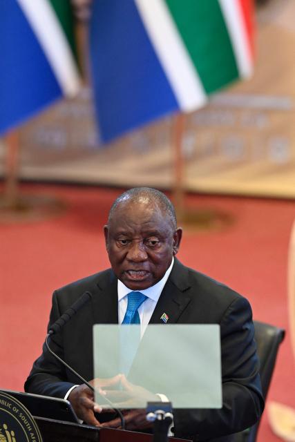 South African President Cyril Ramaphosa gestures as he delivers the State of the Nation (SONA) address in Cape Town on February 12, 2026. (Photo by Rodger Bosch / POOL / AFP)