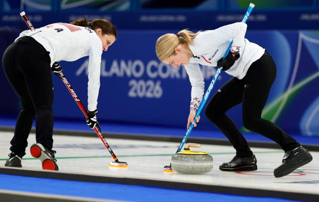 USA's Cory Thiesse (R) and team mate compete in the curling women's round robin between Sweden and USA during the Milano Cortina 2026 Winter Olympic Games at the Cortina Curling Olympic Stadium in Cortina d’Ampezzo on February 12, 2026. (Photo by Odd ANDERSEN / AFP)