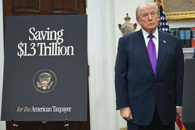 US President Donald Trump looks on during an announcement in the Roosevelt Room of the White House in Washington, DC on February 12, 2026. President Donald Trump on Thursday revoked a landmark scientific finding that underpins US regulations aimed at curbing planet-warming pollution, marking the administration's most far-reaching rollback of climate policy to date. (Photo by SAUL LOEB / AFP)