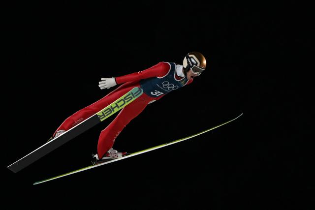 Switzerland's Gregor Deschwanden jumps during the men's ski jumping large hill training of the Milano Cortina 2026 Winter Olympic Games at Predazzo Ski Jumping Stadium in Predazzo (Val di Fiemme), on February 12, 2026. (Photo by Javier SORIANO / AFP)