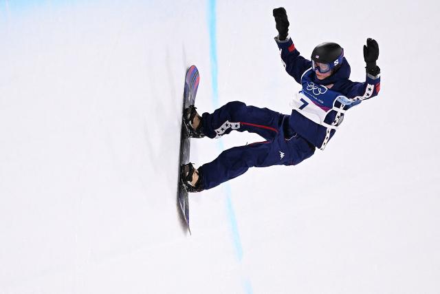 USA's Maddie Mastro competes in the snowboard women's halfpipe final run 2 during the Milano Cortina 2026 Winter Olympic Games at Livigno Snow Park, in Livigno (Valtellina), on February 12, 2026. (Photo by Kirill KUDRYAVTSEV / AFP)