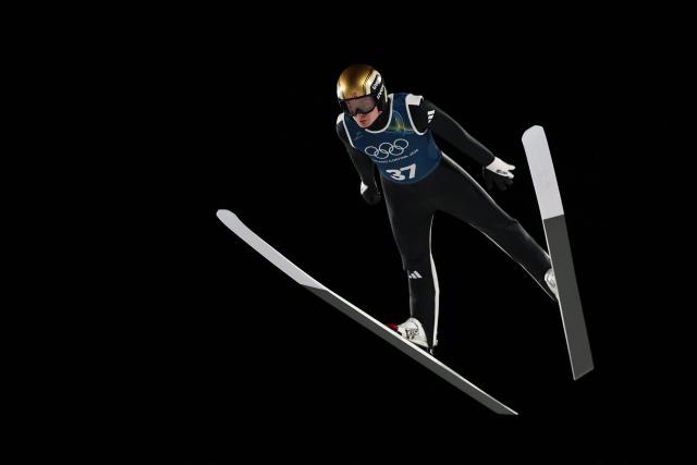 Norway's Marius Lindvik jumps during the men's ski jumping large hill training of the Milano Cortina 2026 Winter Olympic Games at Predazzo Ski Jumping Stadium in Predazzo (Val di Fiemme), on February 12, 2026. (Photo by Anne-Christine POUJOULAT / AFP)