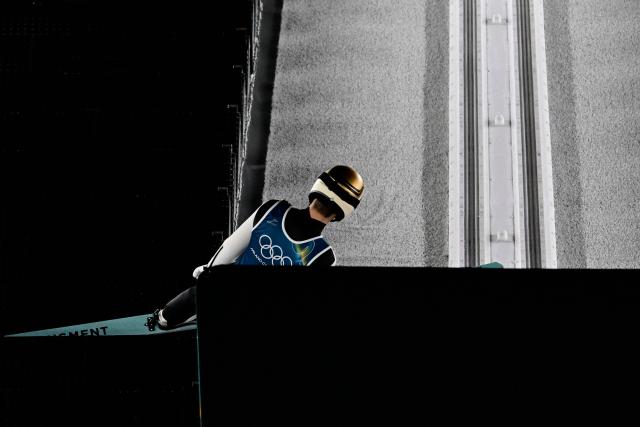 CORRECTION / An athlete prepares for a jump during the men's ski jumping large hill training of the Milano Cortina 2026 Winter Olympic Games at Predazzo Ski Jumping Stadium in Predazzo (Val di Fiemme), on February 12, 2026. (Photo by Tobias SCHWARZ / AFP) / “The erroneous mention[s] appearing in the metadata of this photo by Tobias SCHWARZ has been modified in AFP systems in the following manner: [Japan's Ren Nikaido] instead of [An athlete]. Please immediately remove the erroneous mention[s] from all your online services and delete it (them) from your servers. If you have been authorized by AFP to distribute it (them) to third parties, please ensure that the same actions are carried out by them. Failure to promptly comply with these instructions will entail liability on your part for any continued or post notification usage. Therefore we thank you very much for all your attention and prompt action. We are sorry for the inconvenience this notification may cause and remain at your disposal for any further information you may require.”