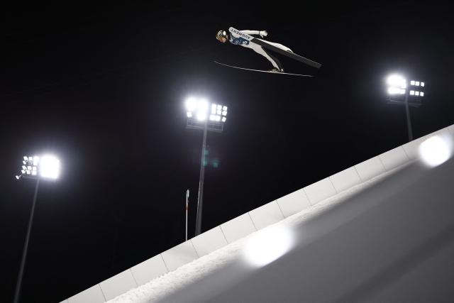 Poland's Kacper Tomasiak jumps during the men's ski jumping large hill training of the Milano Cortina 2026 Winter Olympic Games at Predazzo Ski Jumping Stadium in Predazzo (Val di Fiemme), on February 12, 2026. (Photo by Anne-Christine POUJOULAT / AFP)