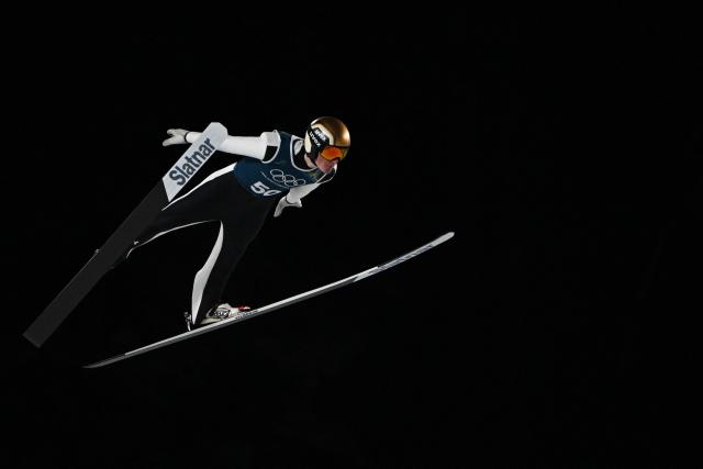 Slovenia's Domen Prevc jumps during the men's ski jumping large hill training of the Milano Cortina 2026 Winter Olympic Games at Predazzo Ski Jumping Stadium in Predazzo (Val di Fiemme), on February 12, 2026. (Photo by Javier SORIANO / AFP)