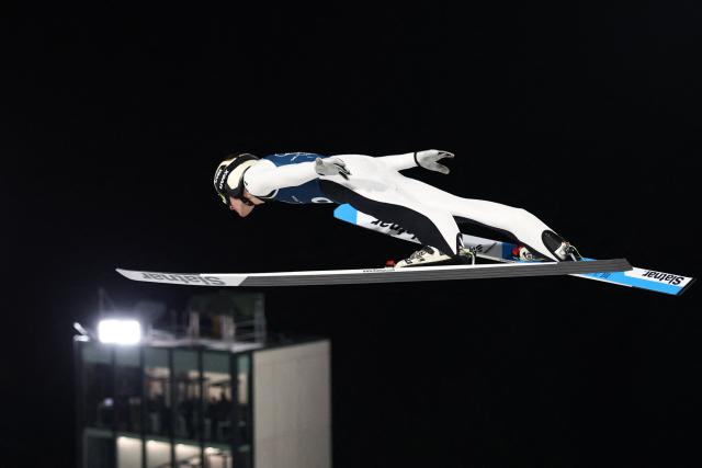 Slovenia's Domen Prevc jumps during the men's ski jumping large hill training of the Milano Cortina 2026 Winter Olympic Games at Predazzo Ski Jumping Stadium in Predazzo (Val di Fiemme), on February 12, 2026. (Photo by Anne-Christine POUJOULAT / AFP)
