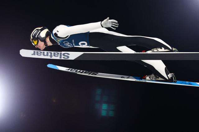 Slovenia's Domen Prevc jumps during the men's ski jumping large hill training of the Milano Cortina 2026 Winter Olympic Games at Predazzo Ski Jumping Stadium in Predazzo (Val di Fiemme), on February 12, 2026. (Photo by Anne-Christine POUJOULAT / AFP)