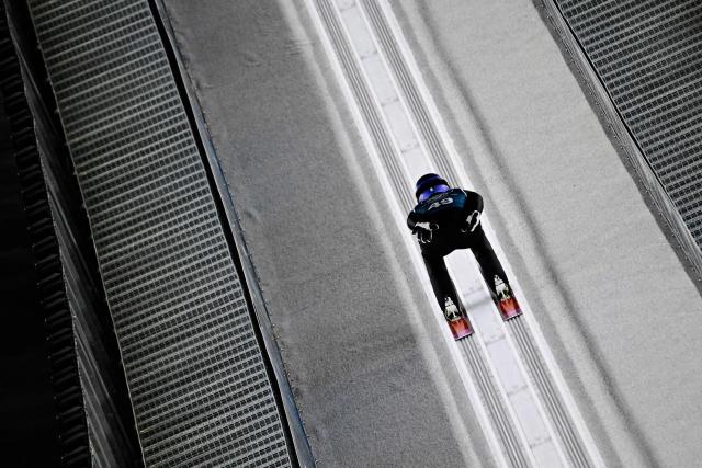 Japan's Ryoyu Kobayashi slides down the inrun track during the men's ski jumping large hill training of the Milano Cortina 2026 Winter Olympic Games at Predazzo Ski Jumping Stadium in Predazzo (Val di Fiemme), on February 12, 2026. (Photo by Tobias SCHWARZ / AFP)