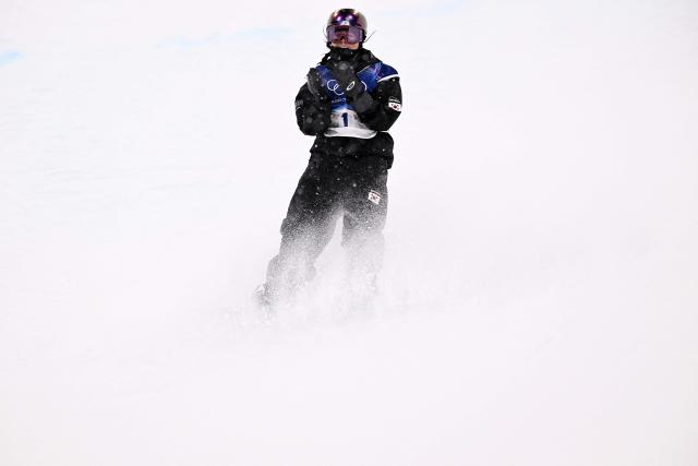 South Korea's Choi Gaon reacts in the snowboard women's halfpipe final run 3 during the Milano Cortina 2026 Winter Olympic Games at Livigno Snow Park, in Livigno (Valtellina), on February 12, 2026. (Photo by Kirill KUDRYAVTSEV / AFP)