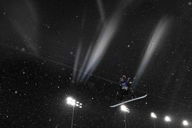 South Korea's Choi Gaon competes in the snowboard women's halfpipe final run 3 during the Milano Cortina 2026 Winter Olympic Games at Livigno Snow Park, in Livigno (Valtellina), on February 12, 2026. (Photo by Jeff PACHOUD / AFP)